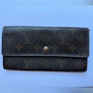 Authentic vintage Louis Vuitton Monogram Sarah Wallet with gold-tone hardware.